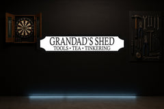 GRANDAD'S SHED · TOOLS • TEA • TINKERING — personalised 3D street sign, shown in place