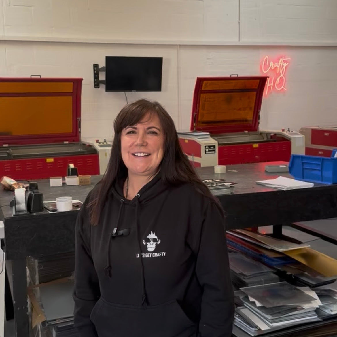 Mum in the workshop in front of the laser cutters at Crafty HQ