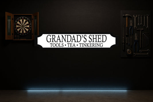 GRANDAD'S SHED · TOOLS • TEA • TINKERING — personalised 3D street sign, shown in place
