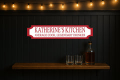 KATHERINE'S KITCHEN · AVERAGE COOK, LEGENDARY DRINKER — personalised 3D street sign, shown in place