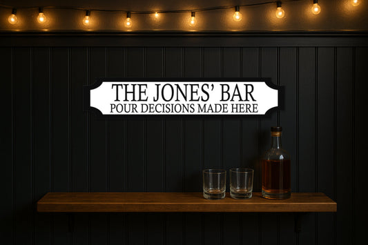 THE JONES' BAR · POUR DECISIONS MADE HERE — personalised 3D street sign, shown in place