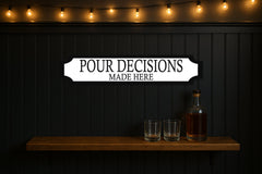 POUR DECISIONS · MADE HERE — personalised 3D street sign, shown in place